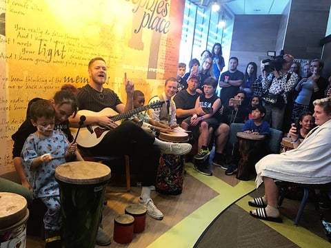 Dan Reynolds, of pop/rock band Imagine Dragons, teaches patients at Sutter Children’s Center to drum and strum to radio hits. The visit was part of the hospital’s ongoing music therapy program for sick kids.